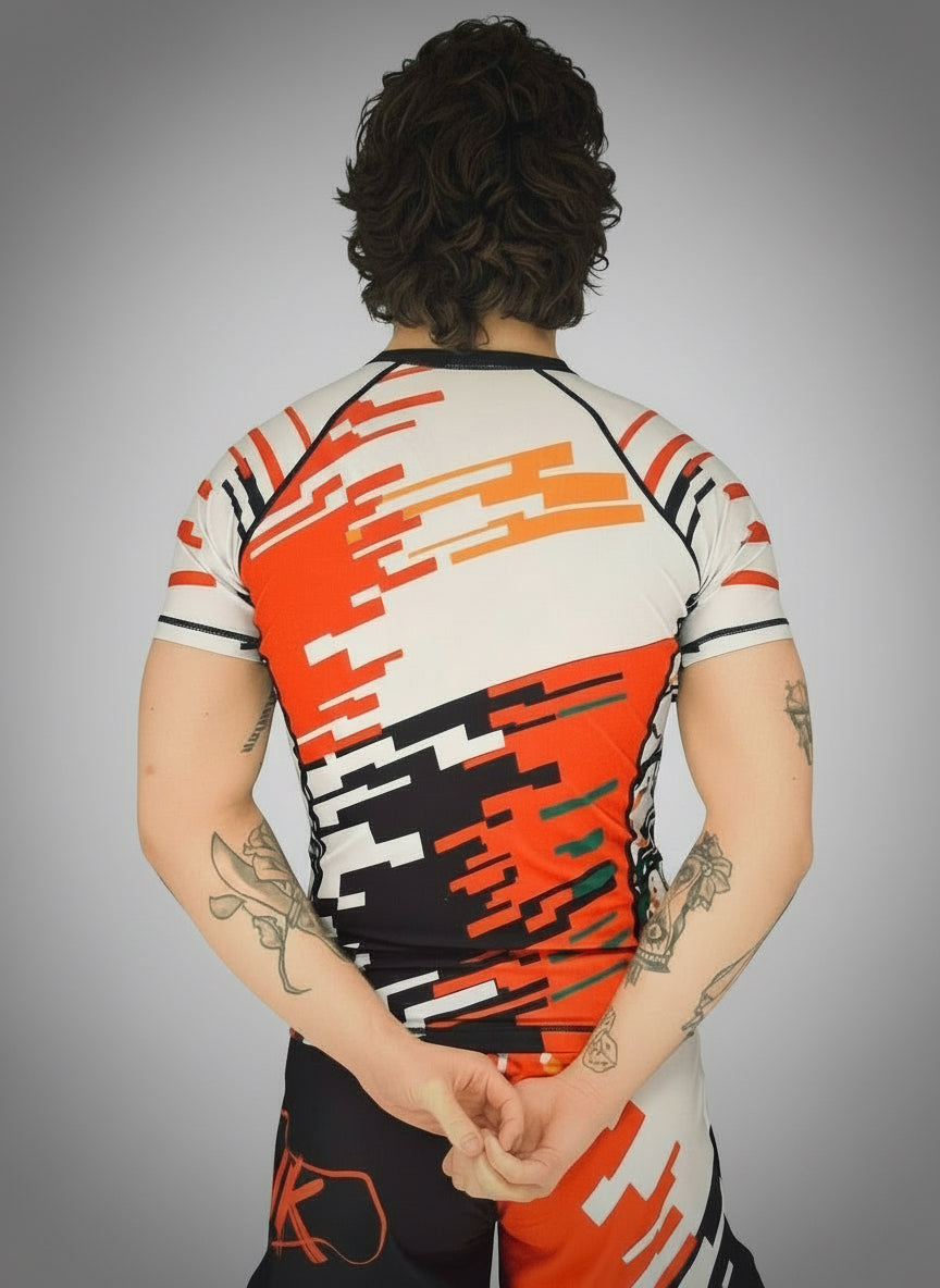 Person wearing a colorful athletic shirt with a white background