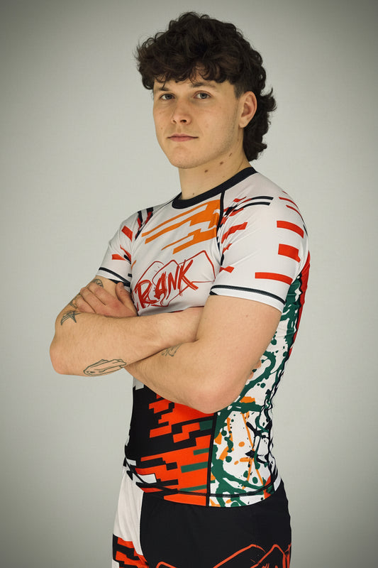 Person wearing a colorful sports jersey with 'ANK' branding against a white background